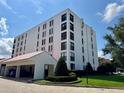 Low angle view of the condo building with parking and landscaping at 265 E Canton Ave # Ge, Winter Park, FL 32789