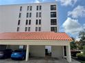 The condo building has covered parking and nicely manicured landscaping at 265 E Canton Ave # Ge, Winter Park, FL 32789
