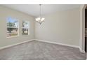 Dining room featuring tile flooring, white walls, and a chandelier at 2901 Harvest Hill Ln, Orlando, FL 32824