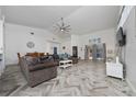 Spacious living room boasts high ceilings, modern flooring, and ample natural light at 2902 Paddington Way, Kissimmee, FL 34747