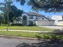 Charming two-story home featuring a two-car garage and well-maintained landscaping at 3170 Zaharias Dr, Orlando, FL 32837
