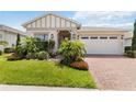Charming single-story home featuring a well-manicured lawn and a two-car garage at 3378 Sagebrush St, Harmony, FL 34773