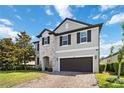 Two-story home boasting stone accents, well-maintained lawn and a two-car garage at 3425 Middlebrook Pl, Harmony, FL 34773