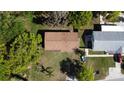 Aerial view of single-Gathering home with mature trees and lush landscaping surrounding the property at 453 E Jessup Ave, Longwood, FL 32750