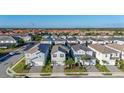 A beautiful aerial view of a suburban neighborhood with lush greenery and well-maintained homes at 7184 Oakmoss Loop, Davenport, FL 33837