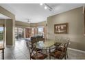 Dining room with table, chairs, and sliding doors to the balcony at 8601 Worldquest Blvd # B1/U3502, Orlando, FL 32821