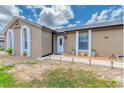 Close-up of a single-story home featuring a walkway with landscape lighting at 987 Trumbull St, Deltona, FL 32725