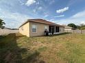Large backyard with partial fence and grill, great for outdoor activities and gatherings at 1029 Dampierre Ct, Kissimmee, FL 34759