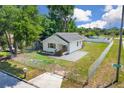 Cozy fenced home featuring a minimalist design, a mailbox, and a well-maintained lawn at 1521 Nieuport Ln, Orlando, FL 32805