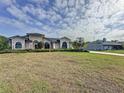 Spacious home featuring a beautiful front lawn and a driveway leading to a detached garage at 2150 Emperor Dr., Kissimmee, FL 34744