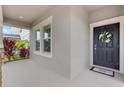 Relaxing front porch with space for seating and beautiful landscaping at 3138 Dark Sky Dr, St Cloud, FL 34773