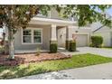 Close up of charming two-story home with landscaped yard and stone accents at 3138 Dark Sky Dr, St Cloud, FL 34773