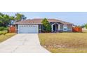 Well-maintained single-Gathering home with a two-car garage and mature landscaping at 402 Ohio Way, Kissimmee, FL 34759