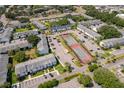 A community aerial view showcasing building exteriors, parking, and tennis courts at 4403 S Semoran Blvd # 2, Orlando, FL 32822