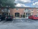 Brick building featuring second story balconies and convenient parking at 492 Banyon Tree Cir # 204, Maitland, FL 32751