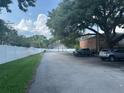 A parking lot next to well-manicured landscaping at 492 Banyon Tree Cir # 204, Maitland, FL 32751
