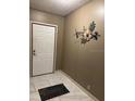 Inviting entryway with tile flooring and decorative wall art at 503 Tivoli Park Dr, Davenport, FL 33897