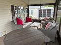 Cozy screened lanai with comfortable seating and view of the neighborhood at 503 Tivoli Park Dr, Davenport, FL 33897