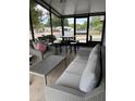 Relaxing screened-in lanai with seating and table perfect for entertaining at 503 Tivoli Park Dr, Davenport, FL 33897