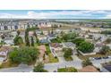 An aerial view of a residential neighborhood with well-maintained homes and green spaces on a sunny day at 521 Rena Dr, Davenport, FL 33897