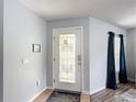 Welcoming foyer showcasing a decorative glass front door and ceramic flooring at 521 Rena Dr, Davenport, FL 33897