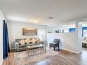Inviting living room features a comfortable sofa, decorative pillows, and a stylish coffee table at 521 Rena Dr, Davenport, FL 33897