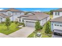 Aerial view of the home showcasing its layout, landscaping, and proximity to neighboring houses at 983 Silverlake Blvd, Lake Alfred, FL 33850