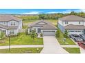 Wide angle aerial shot of home's elevation highlighting the surrounding community and neighborhood at 983 Silverlake Blvd, Lake Alfred, FL 33850