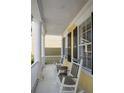 Relaxing porch with rocking chairs is ideal for enjoying the outdoors at 1115 Mosaic Dr, Celebration, FL 34747