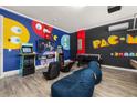 Fun game room features classic arcade games, TV, foosball table and beanbag chairs at 420 Burma St, Kissimmee, FL 34747