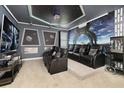 Amazing home theater with seating, themed decor, and a popcorn machine for immersive entertainment at 420 Burma St, Kissimmee, FL 34747
