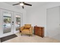 Cozy room with easy access to pool through french doors, a sleek ceiling fan, and tiled floors at 5234 Ohio St, Winter Park, FL 32792