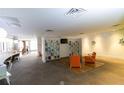 Modern lobby area with cozy seating, built-in shelving, and natural light at 5245 W Irlo Bronson Memorial Hwy # 148, Kissimmee, FL 34746