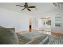 Spacious living room with hardwood floors and abundant natural light at 606 N Mcdonald St, Mount Dora, FL 32757