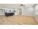 Open concept living and kitchen space showcasing hardwood floors and lots of natural light at 918 Louise Ln, Deland, FL 32720