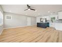 Open concept living and kitchen space showcasing hardwood floors and lots of natural light at 918 Louise Ln, Deland, FL 32720