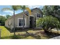 Lush landscaped home exterior offering curb appeal with a well maintained lawn at 979 Hacienda Cir, Kissimmee, FL 34741