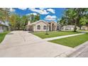 Attractive house showcasing a lengthy driveway and well-maintained front yard at 101 Majestic Forest Run, Sanford, FL 32771