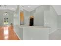 Kitchen and breakfast bar, connecting the kitchen to the living spaces at 101 Majestic Forest Run, Sanford, FL 32771