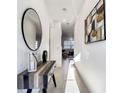 Bright foyer showcases tile flooring, modern decor, console table with decorative accessories, and ample lighting at 1067 Plantation Ln, Davenport, FL 33896