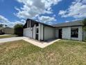 Single-story home with a well-maintained lawn and neutral exterior paint at 116 Talavera Ln, Kissimmee, FL 34758