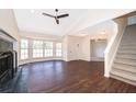 Spacious living room boasts a vaulted ceiling, fireplace, and large bay window at 120 W Minnehaha Ave, Clermont, FL 34711