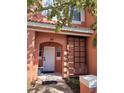 Charming two-story townhouse featuring a welcoming walkway and decorative accents at 153 Pompano Beach Dr Dr, Kissimmee, FL 34746