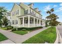 Charming home with a spacious front porch and well-manicured lawn at 1850 Treasure Cv, Celebration, FL 34747