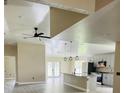 Open-concept kitchen featuring an island, stainless steel appliances, and neutral-colored cabinetry at 2385 Andrews Valley Dr, Kissimmee, FL 34758