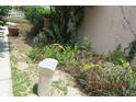 This home's garden space includes stones and plants at 386 San Jose Dr, Winter Haven, FL 33884