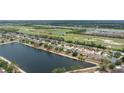 Serene community homes surrounding a lake and lush golf course, offering a picturesque neighborhood at 5210 Silver Thistle Ln, St Cloud, FL 34772