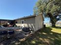The backyard features a covered patio area that is perfect for entertaining and relaxation at 622 Dromedary Ct, Kissimmee, FL 34759