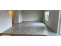Spacious living room with ceramic flooring and plenty of natural light at 1148 Sugarwood St, Davenport, FL 33837