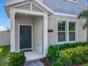 Welcoming front entrance with a dark-colored door, decorative landscaping, and clear address numbers for easy identification at 1373 Williams Rd, Winter Garden, FL 34787